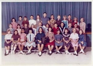 Gloria (third from left in front row), in Mrs. Van Ness' 5th grade class